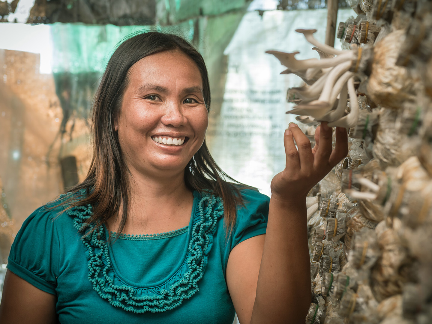 Woman at the mushroom cultivation supported by the German Savings Banks Foundation